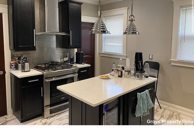 Kitchen - 4 bedroom 2 bathroom apartment with washer and dryer.