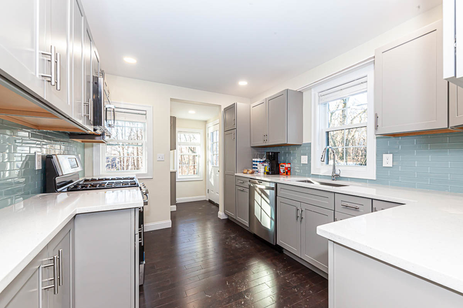 - - Newer 5-Bed/5-Bath Waltham Home with Decks and Parking