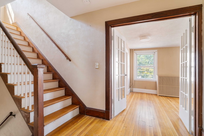 Entry - huge closet right as you walk in, access to living spaces and bedrooms on third floor - Spacious Oak Square Apartment