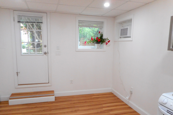 living room w/space for full-size couch - 1-bedroom apartment in Cambridgeport two-family, ideal location, lots of privacy, yard and laundry