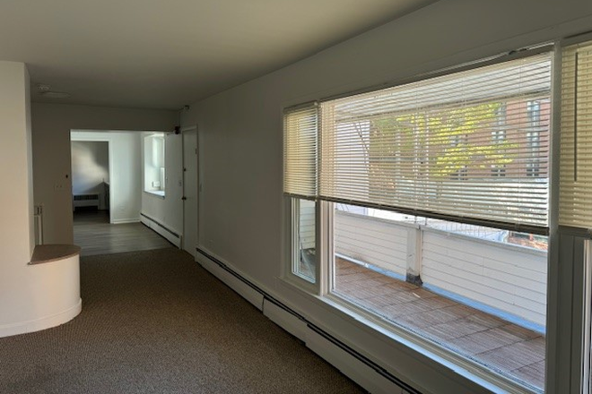 Living Room (w/view of Private Porch) - AVAILABLE FOR 2025-2026 SCHOOL YEAR-- NEWLY RENOVATED HUGE 3 BEDROOM 1.5 BATH APARTMENT, IN-UNIT W/D