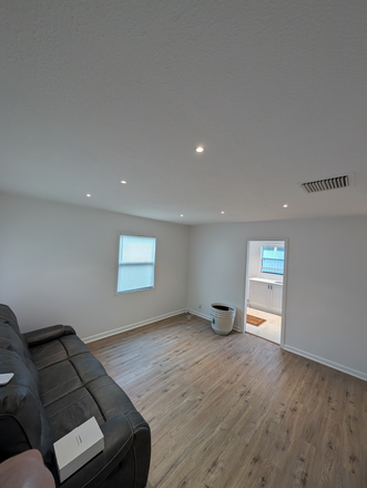 Updated living room - Your Tampa Opportunity Awaits on Tangerine Place! House