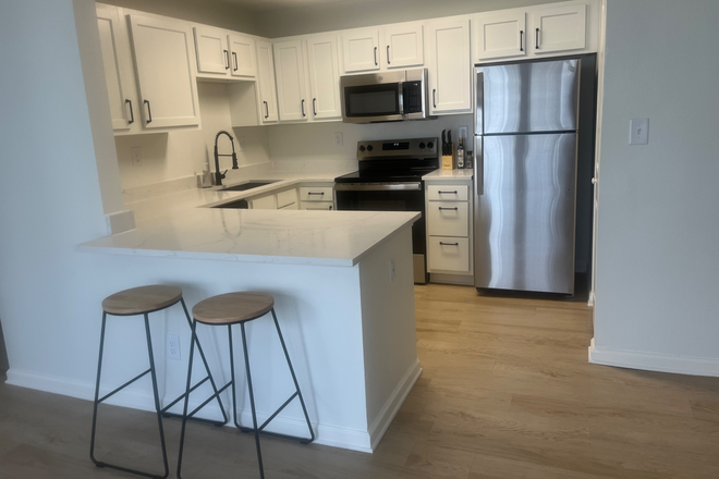 Kitchen -open floor plan - Harper Flatts Condominiums for rent