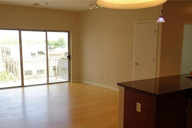 Living room - 2 Bed 2 Bath, Top Floor with Balcony! Walk to The Loop, Roofed Private Parking, and more! Apartments
