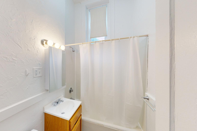 Visit hubrealtyproperties.com - Allston, large studio on basement level, in great building, close to Griggs T stop Green line Apartments