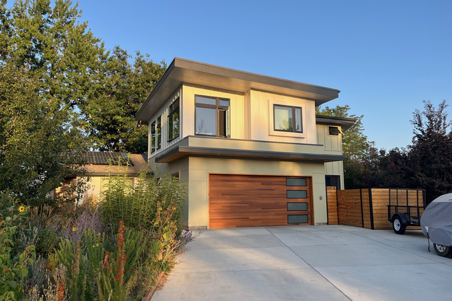 Unit from outside with kitchen and dining room window - 2-Bedroom Townhome/ADU with outside sitting area