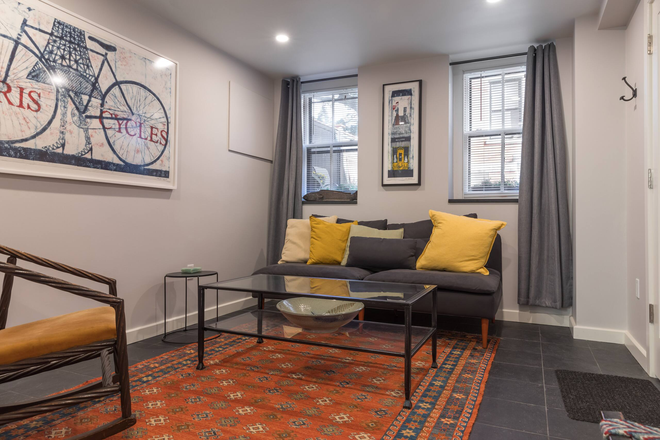 Living room area - Garden level private studio with all utilities Townhome