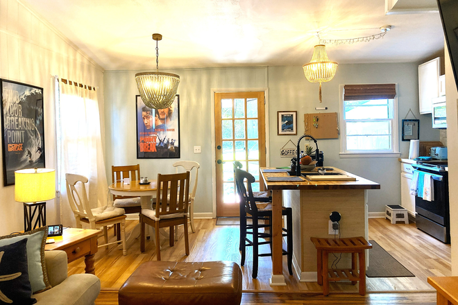 Kitchen & dining area with island, dishwasher under the island & sink - $200 first month discount-Dog-Friendly 3BR 1Bath House-Fenced Yard, Parking & Laundry Furnished/not.