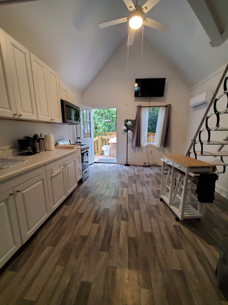 Main Room, view from bathroom to front door - Tiny House close to campus
