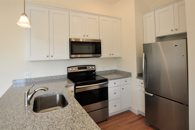 kitchen - Modern 3 bed/2 bath duplex with AC and in unit laundry - no fee! Apartments