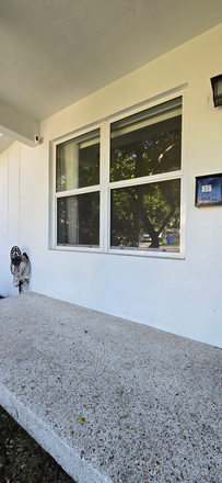 Front porch - large hurricane impact resistant windows throughout! - Cozy 2Br Apartment in Little Havana, close to Coral Gables