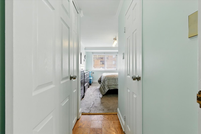 Bedroom Hallway with two closets - Spacious West End 1BR w/ Balcony & 24/7 Concierge, Steps to GWU & Foggy Bottom Metro Access Apartments