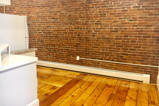 Exposed Brick walls in kitchen - Avail. July 1, 2027 Newly renovated  four bedroom two full bathroom in the center of Amherst! Apartments