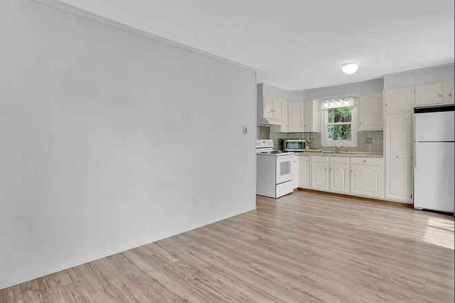 Living room to kitchen - One Bedroom apartment in desirable location with private deck