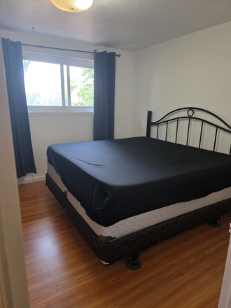 Master Bedroom King Size Bed and Huge Window - 3 Separate Rooms Available in a Shared Townhouse - Furnished with Laundry