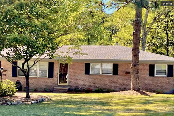 House exterior with grilling porch - Corner lot, huge yard! 3 bed/2 bath house for sublease