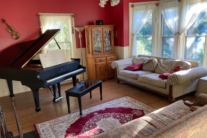 Living Room, with fireplace and Steinway grand piano - Walk to Campus from 144 Old North Rd Kingston, RI 02881 House