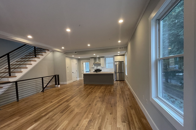 living - BEAUTIFULLY RENOVATED 4 BED/3.5 BATH, IN-UNIT LAUNDRY WITH WATER/SEWER INCLUDED! 9/1/26!