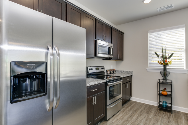 Kitchen with stainless steel appliances - North Colley Apartments- 4 bedroom 2 bath- group or singles