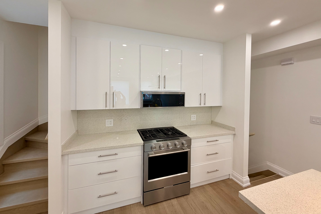 Gas Range and Microwave Fan - 2 Bed/2.5 Bath For Lease Triplex