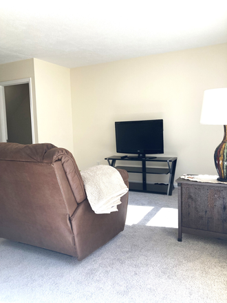 Living Room w/Loveseat, Recliner, and TV - THOUGHTFULLY FURNISHED, FULLY EQUIPPED, UTILITIES INCLUDED, PRICED TO RENT! JUST MINUTES FROM W&M! Townhome