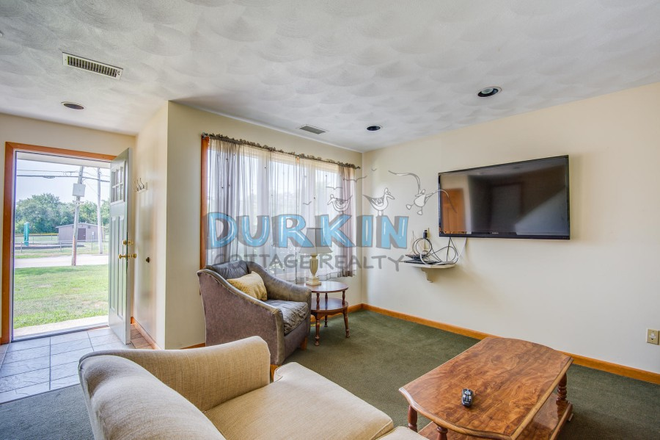 Living Room - Newly Renovated!!! Clean Town Home with Private Patio in Durkin Complex