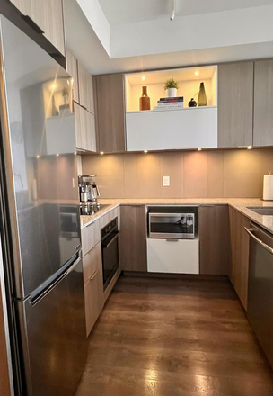 -Fully-equipped kitchen - Furnished 1BR/1BA+Den with Laundry 685 sq ft 12th-Floor Modern Condo in Regent Park