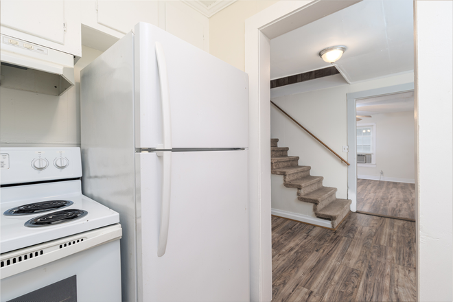 Kitchen 1 - 2-BR townhome in quiet area-laminate, hookups, central location-water, lawncare included