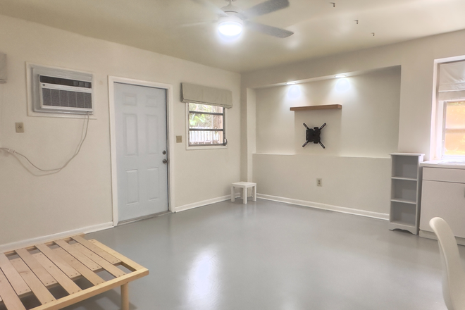 Living area and door to patio - Spacious Studio w/ patio. Private entrance in quiet neighborhood. Includes electric, water and Wifi
