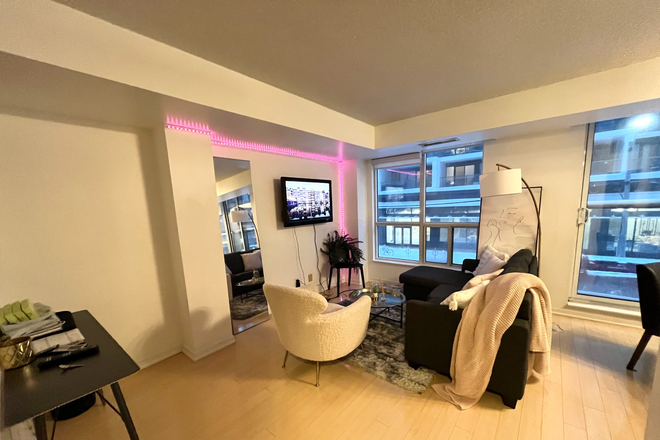 Living room with work area desk - Furnished Room in Quiet Boutique Condominium Central Location Church-Yonge utilities included