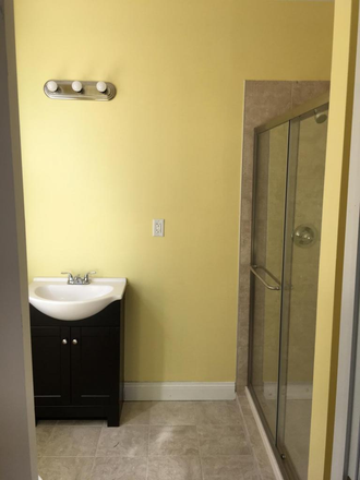 Bathroom (pre-furnished version, now has shelf-cart, plastic drawer-dresser, trash can) - Spacious 1b1b Apartment on 30th Street, 7 min from Homewood Campus