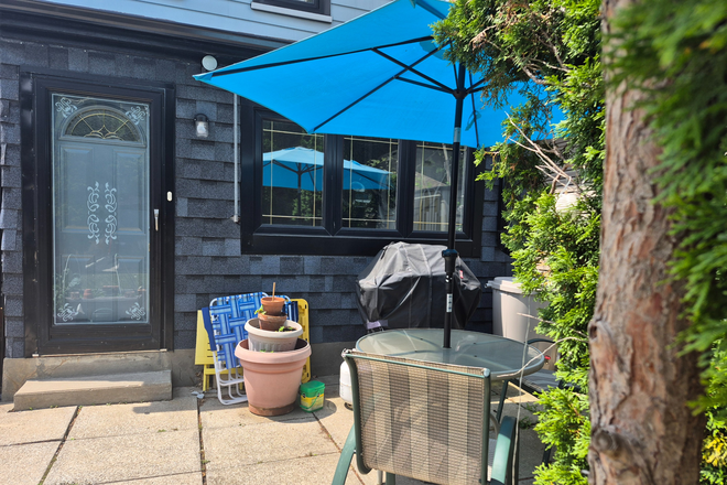 Exterior entrance/Exit and backyard patio space - Bright and comfy 1 bedroom lower suite with shared backyard, St. Clair West House