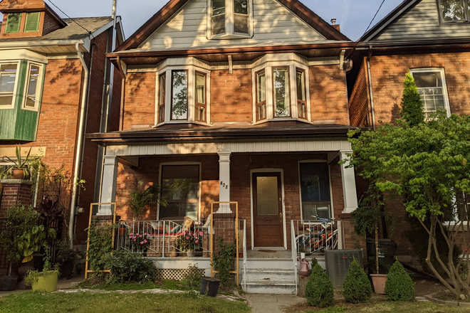 Front of house.  Shared entrance in the front, private entrance in the back. - Furnished 1 bedroom apartment with large living room in the Junction