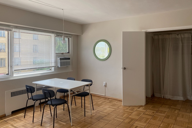 dining area - there are eight chairs and two folding tables for larger dinners or additional workspace - Spacious, bright, freshly renovated and furnished studio in convenient location