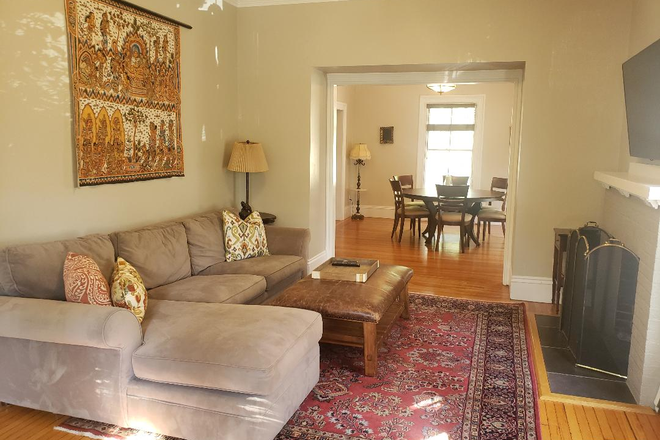 Living Room with Fireplace - Grand Victorian 1BR/2BA in the Heart of Union Square. Includes in-unit laundry, parking & patio.