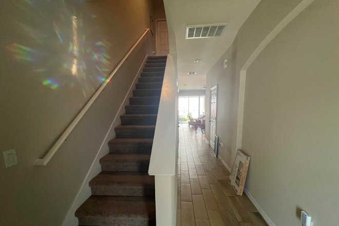 After front door, you will see the stairs and the hallway to the living room/kitchen/dining - Townhouse 10 mins from UCF- very quiet and safe neighborhood