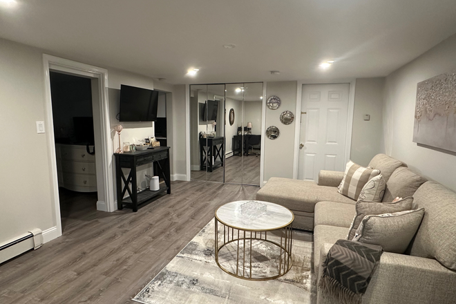 Living room - Available Soon: Renovated 1-Bedroom Basement Apartment Near Stony Brook – Utilities Included!