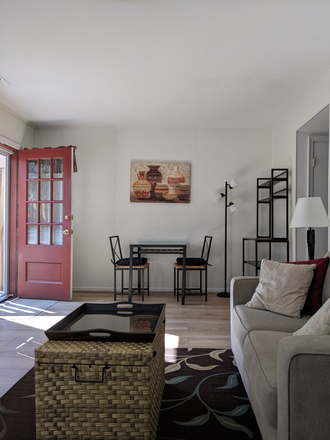 Sitting room with dining area at one end - Furnished 1BR apartment close to GMU and downtown Fairfax City