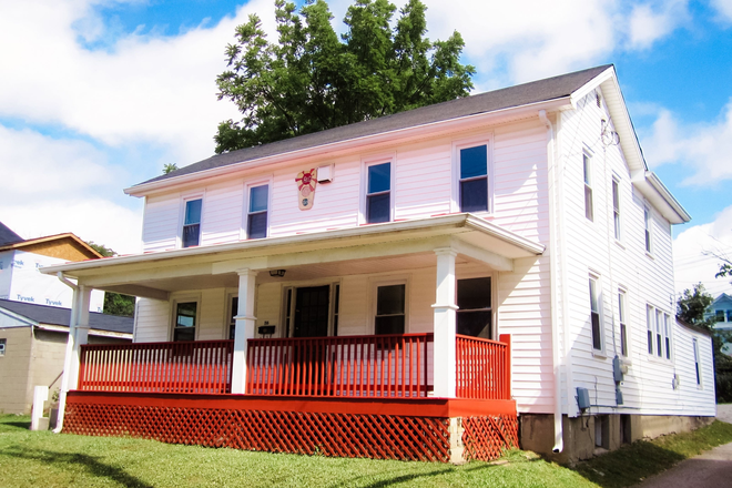 Front of house. The porch is now white, but just as great! - Red Porch District