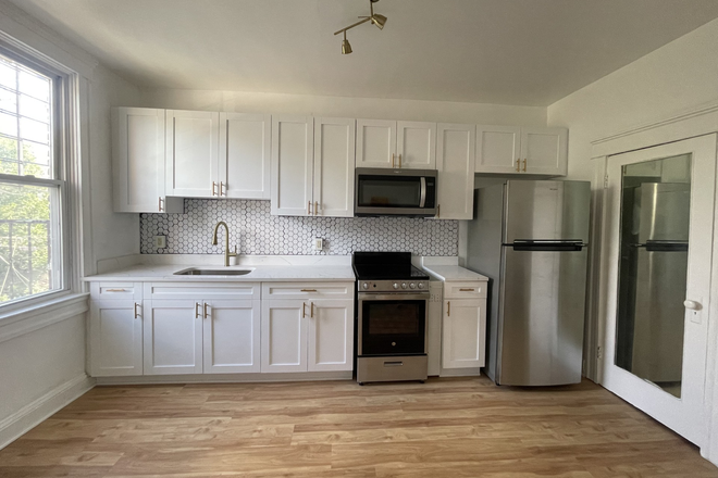 Kitchen, stainless steel appliances - Modern Comfort in Remington | Steps from JHU, 4 minute walk to Homewood