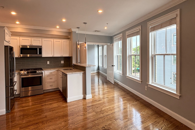 living room - Modern Forest Hills 2 bed + office with AC, deck, and in unit laundry - NO FEE!