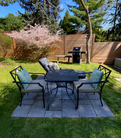 your private patio with lounge chair, BBQ, table for 2 - Modern furnished Swansea/BloorWestVillage studio apt + ravine patio (utilities+WIFI included)