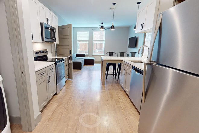 Common area, kitchen, and laundry - Aspen Heights Apartment