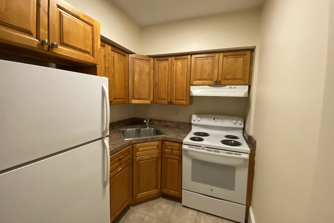 Visit hubrealtyproperties.com - Large 3 bedroom, basement level with updates, in the Fenway Apartments