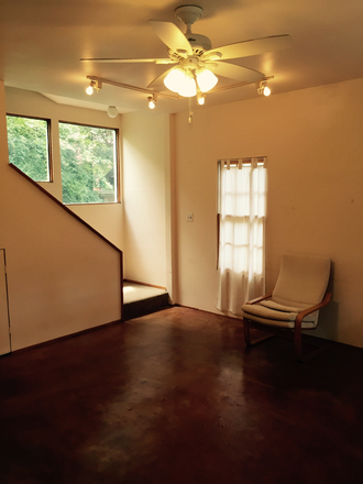 Living Room to stairs - Quiet 2 story garden house blocks from Rice/TMC; new kitchen & W/D, 9’ ceiling, Saltillo, terrazzo