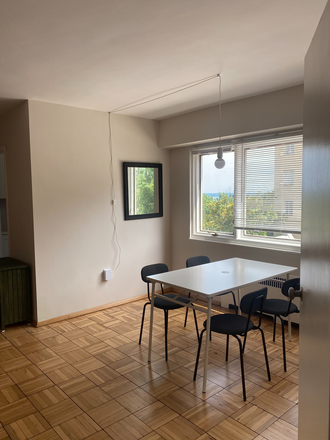 dining area - there are eight chairs and two folding tables for larger dinners or additional workspace - Spacious, bright, freshly renovated and furnished studio in convenient location Condo