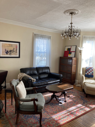 living room - eastside 2 bedroom, freshly painted, central air, 2 car parking in back Apartments