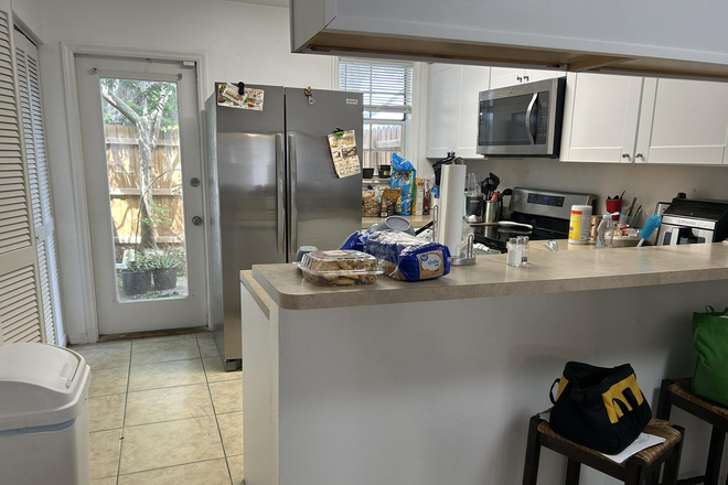 Kitchen with 2 stools at bar - 1 room, private bath available in 2 br townhouse