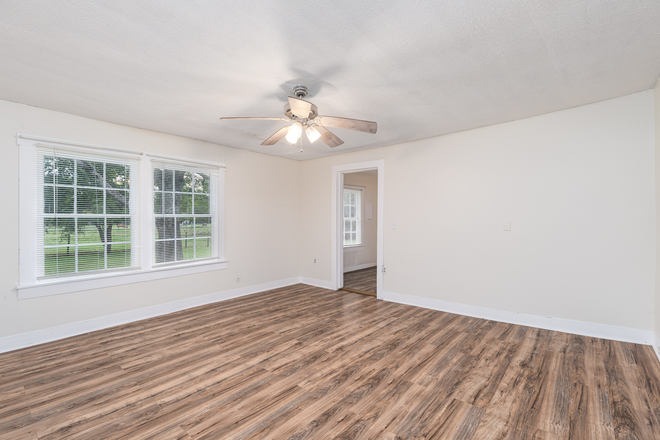 Living room 3 - 2-BR townhome in quiet area-laminate, hookups, central location-water, lawncare included