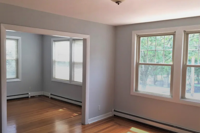 Dining room looking into living room - "Posh Wayland Sq. renovated unit with Jacuzzi tub, view of park, off-street parking" Condo